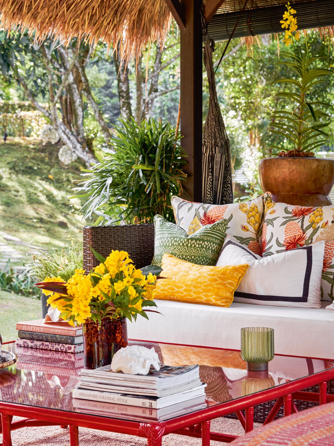 The stylish pool house is full of colourful botanical and tropical prints