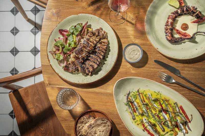 Lamb al asador, anchovies & boquerones, charred octopus tentacles