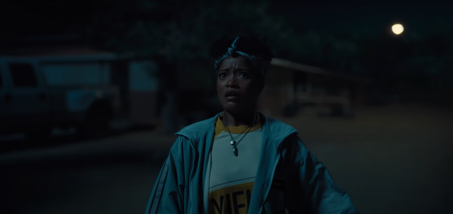 Keke Palmer's character looks up the sky and screams 'RUN!' (Photo: NOPE trailer)