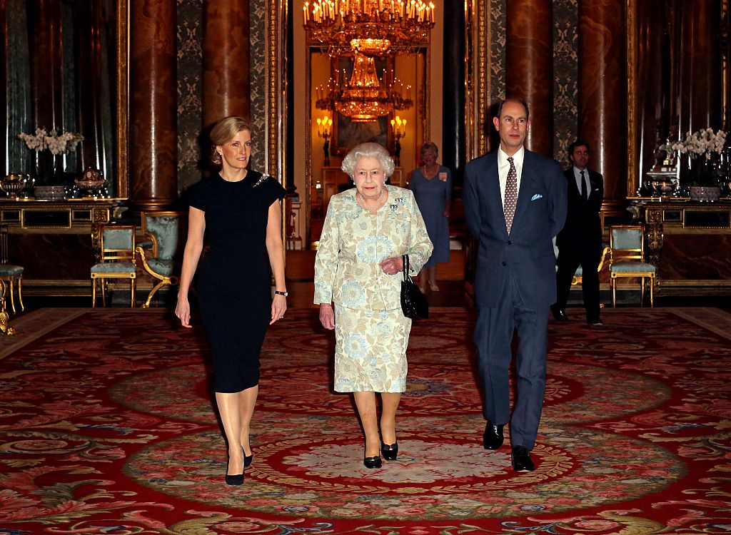 LONDON, UNITED KINGDOM - FEBRUARY 10: Queen Elizabeth II (R) with Sophie, Countess of Wessex (L) and Prince Edward, Earl of Wessex during her reception to celebrate the patronages & affiliations of the Earl and Countess of Wessex at Buckingham Palace on February 10, 2015 in London, England (Photo by Chris Radburn - WPA Pool/Getty Images)
