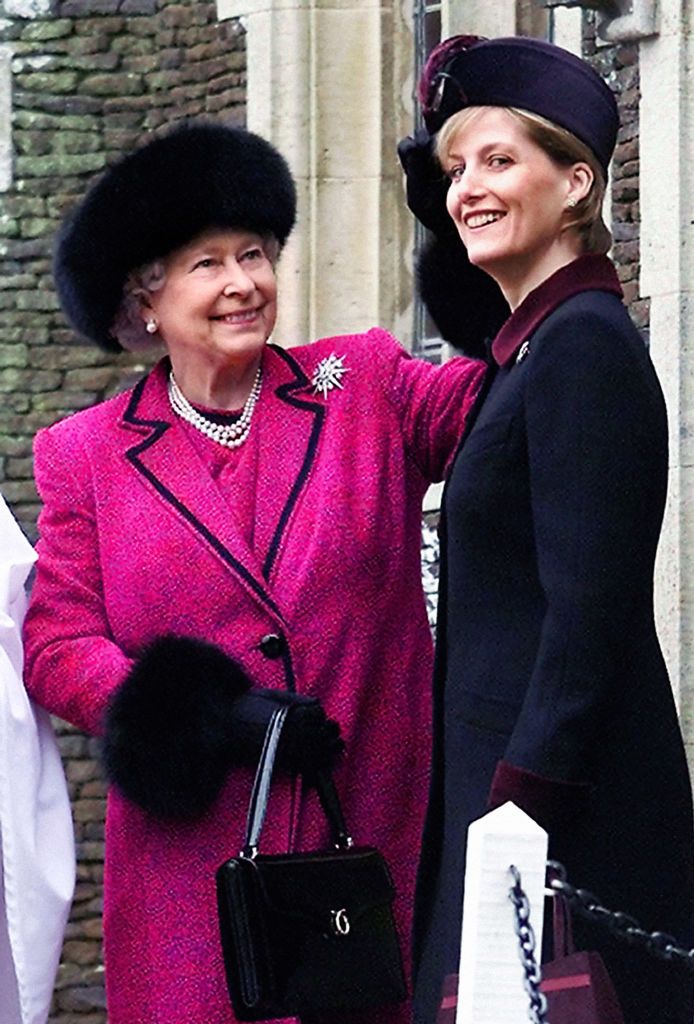 Britain's Queen Elizabeth II, left, straightens Sophie, The Countess of Wessex's hat, while the wait to attend the Christmas Day service at the Sandringham Church. (Photo by PA Images via Getty Images)