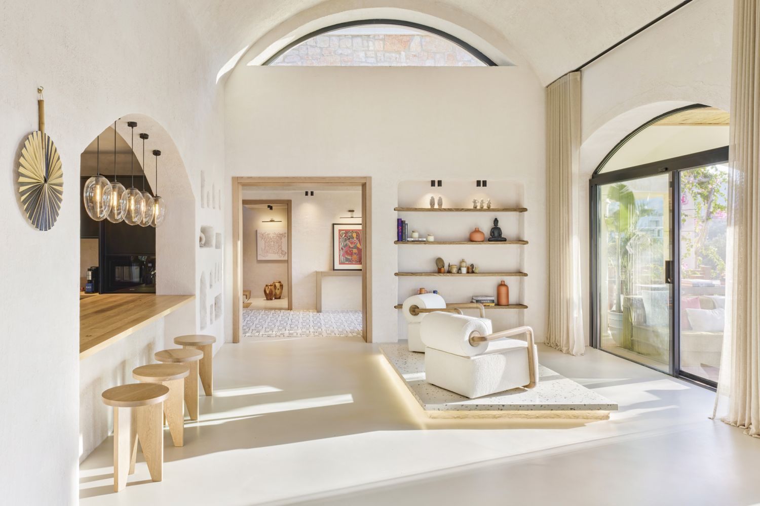 Decorative plaster on the walls and a micro-concrete finish on the flooring give the home a serene ambience
