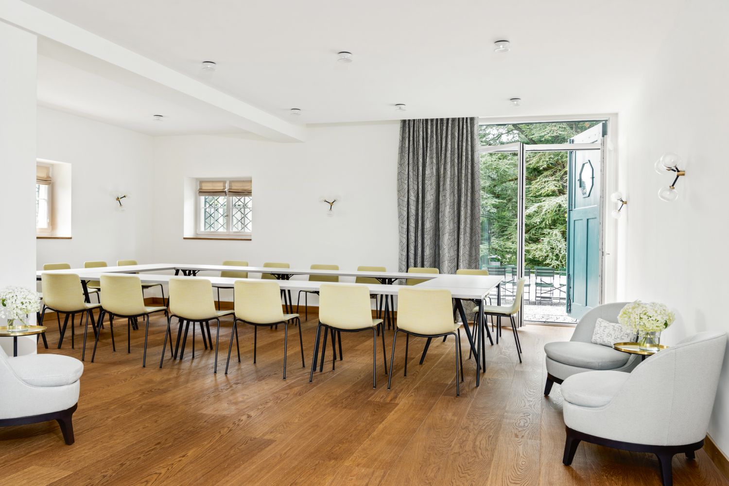 This meeting room features the same chair designs as those in the pavilion, upholstered in similar pastel hues
