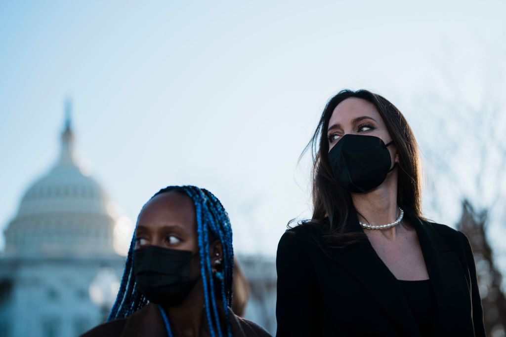 WASHINGTON, DC - FEBRUARY 09: Actress Angelina Jolie, right, walks with her daughter Zahara Jolie-Pitt, left, leave the U.S. Capitol after Jolie spoke at a news conference on the bipartisan modernized Violence Against Women Act (VAWA) on Capitol Hill on Wednesday, Feb. 9, 2022 in Washington, DC. (Kent Nishimura / Los Angeles Times via Getty Images)