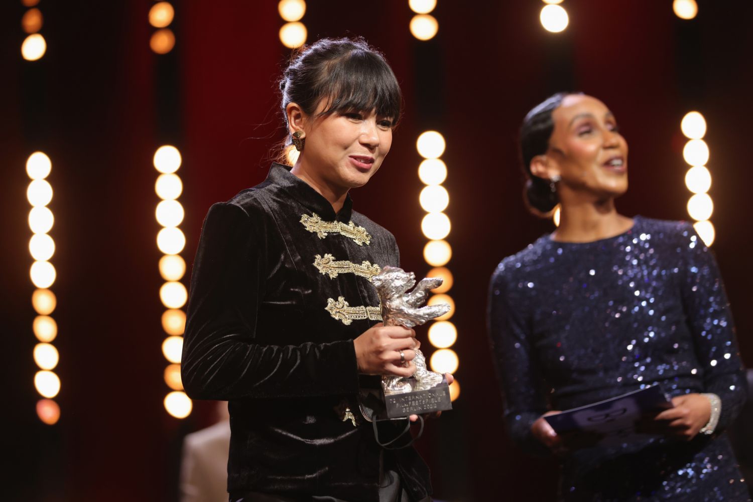 BERLIN, GERMANY - FEBRUARY 16: Director Kamila Andini excepts the Silver Bear for Best Supporting Performance for the film "Nana" on behalf of Laura Basuki at the closing ceremony during the 72nd Berlinale International Film Festival Berlin at Berlinale Palast on February 16, 2022 in Berlin, Germany. (Photo by Sean Gallup/Getty Images)