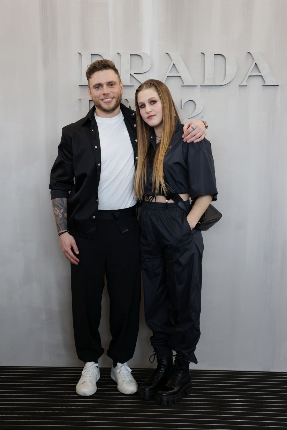 MILAN, ITALY - FEBRUARY 24: Gus Kenworthy and Julia Marino attend Prada Fall 2022 Womenswear Fashion Show on February 24, 2022 in Milan, Italy. (Photo by Vittorio Zunino Celotto/Getty Images for Prada)