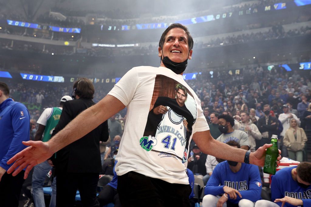 DALLAS, TEXAS - JANUARY 05: Dallas Mavericks team owner Mark Cuban wears a shirt honoring former player Dirk Nowitzki during a ceremony honoring his Nowitzki's career and retiring his No. 41 jersey at American Airlines Center on January 05, 2022 in Dallas, Texas. NOTE TO USER: User expressly acknowledges and agrees that, by downloading and or using this photograph, User is consenting to the terms and conditions of the Getty Images License Agreement. (Photo by Tom Pennington/Getty Images)