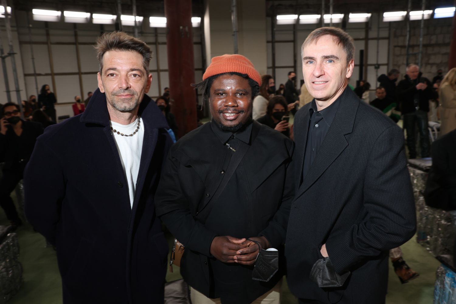 MILAN, ITALY - FEBRUARY 26: Pieter Mulier, Alvaro Barrington and Raf Simons arrive at Bottega Veneta Fashion Show Fall/Winter 2022/2023 at Palazzo Fedele on February 26, 2022 in Milan, Italy. (Photo by Victor Boyko/Getty Images for Bottega Veneta)