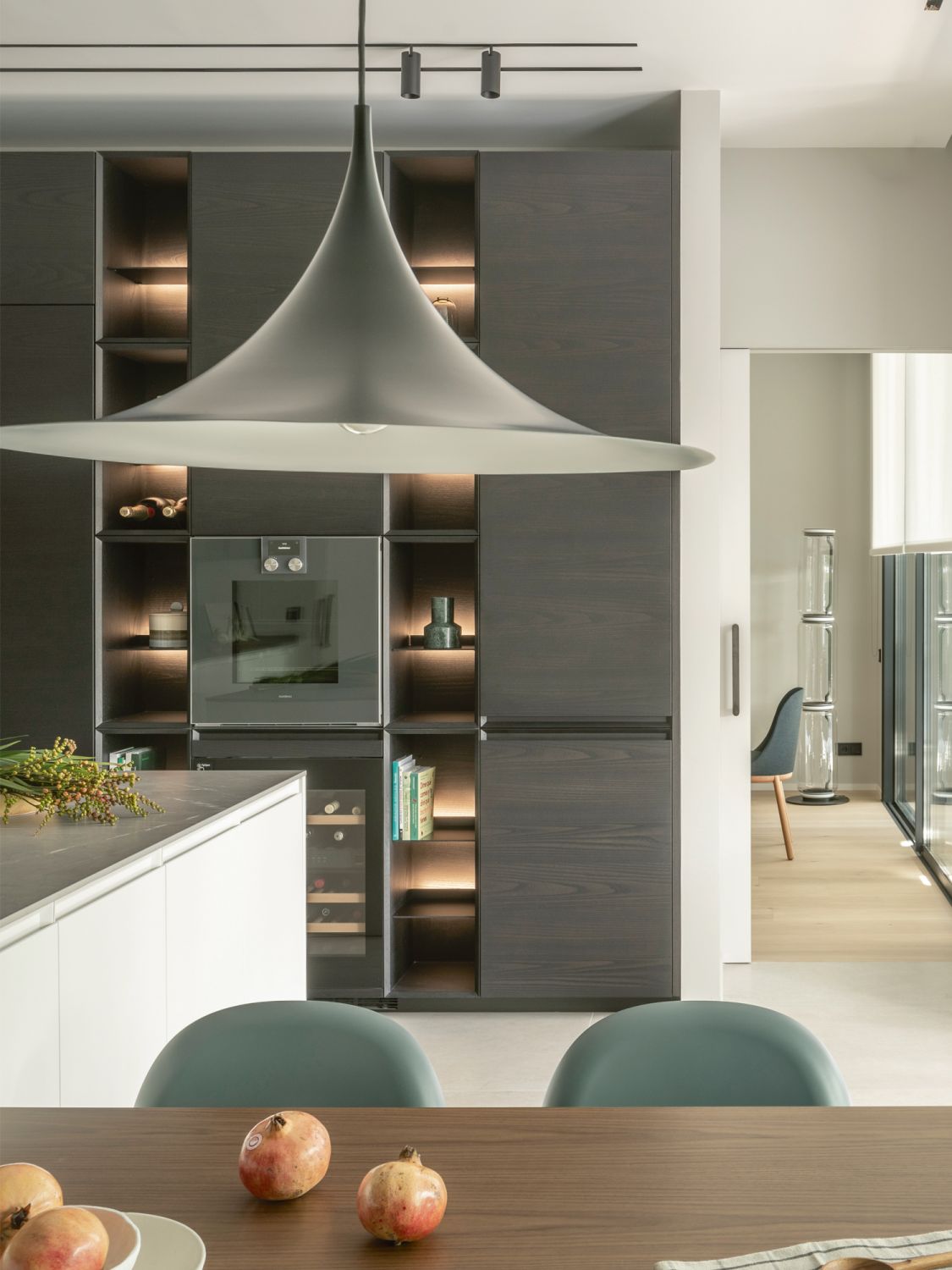 Backlit display shelves bring a touch of elegance to the kitchen