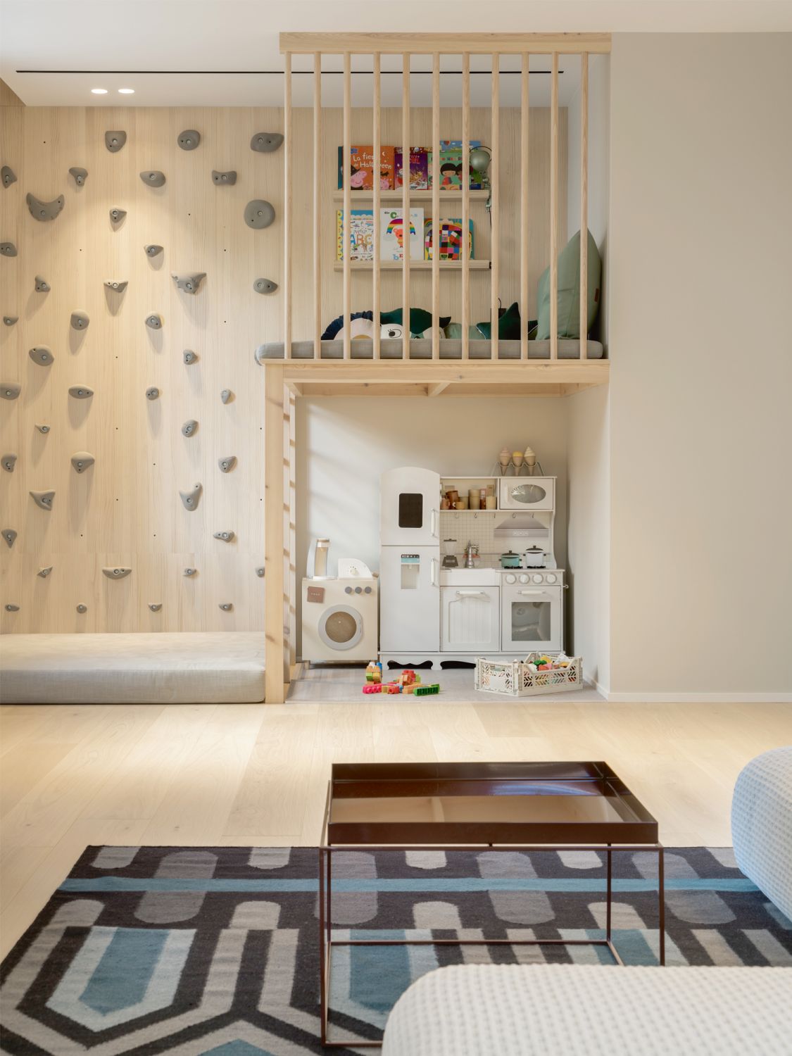 A bouldering wall and play area keep the children entertained
