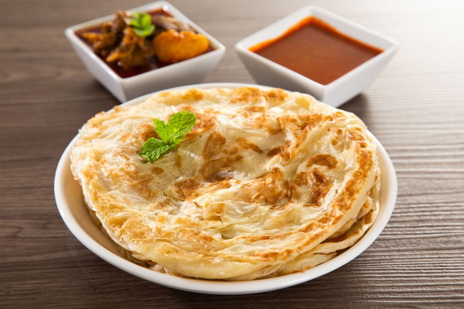 A full roti canai meal, complete with curry (Photo: iStock)