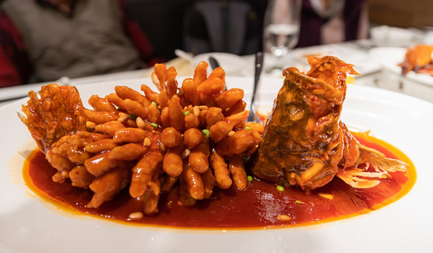 pinyin: sÅngshÇ guÃ¬yÃº) is a well-known dish in Jiangsu cuisine, originally from Suzhou. It is prepared by deboning and carving a mandarin fish into an ornamental shape similar to a squirrel, and then deep-frying it in batter before dousing it in sweet and sour sauce.