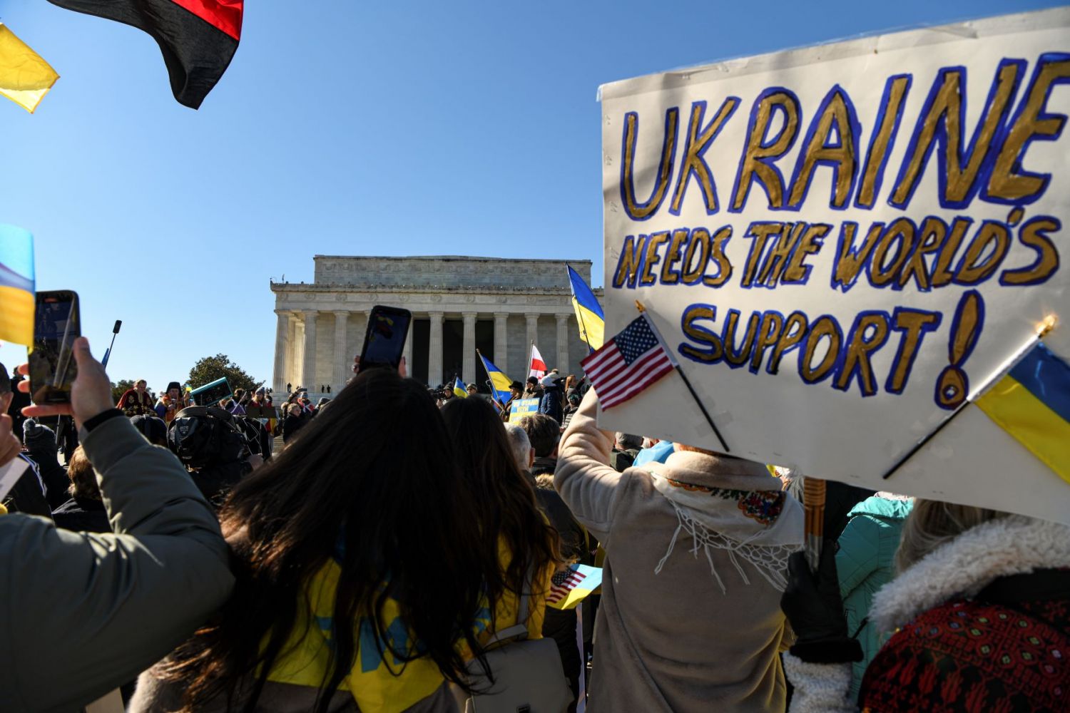 WASHINGTON, DC - FEBRUARY 20: Demonstrators gather at the Lincoln Memorial to protest against the rising tensions between Russia and Ukraine before marching to the White House on February 20, 2022 in Washington, DC. Attendees called for U.S. President Joe Biden to take a stronger stance on deterring Russia from invading Ukraine and demanded the end of Russia's occupation of Crimea. (Photo by Kenny Holston/Getty Images)