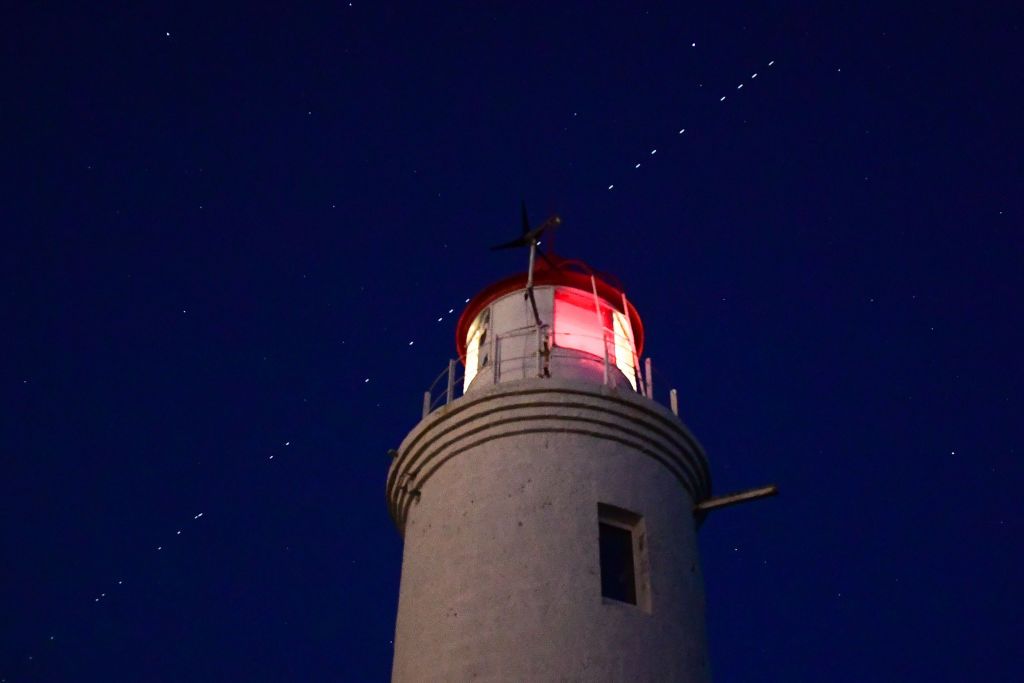 VLADIVOSTOK, RUSSIA - APRIL 27, 2020: 60 of the Starlink Internet communication satellites of Elon Musk's SpaceX private spaceflight company seen in the night sky. On April 22, 2020, SpaceX successfully launched 60 Starlink satellites into orbit on the Falcon 9 rocket from NASA's Kennedy Space Center at Cape Canaveral. The Starlink project is aimed at providing low-cost internet to remote locations; SpaceX is planning to launch into orbit about 30,000 satellites. Following the launch of the first batch of t