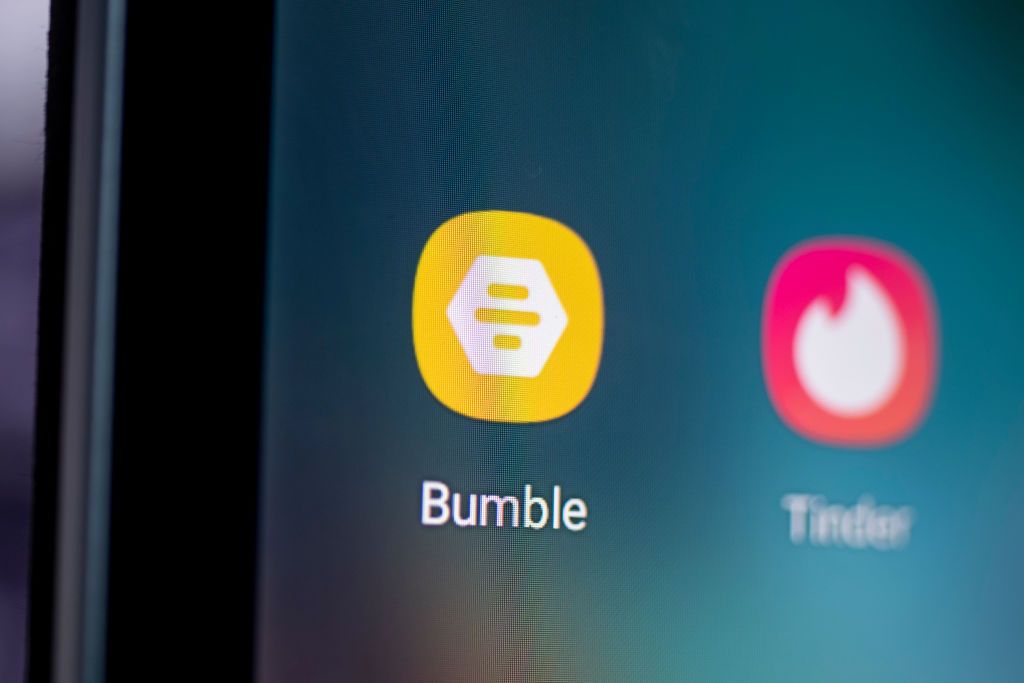 ILLUSTRATION - 28 April 2021, Berlin: The logo of the dating app Bumble (l) is seen on the screen of a smartphone. Photo: Fabian Sommer/dpa (Photo by Fabian Sommer/picture alliance via Getty Images)