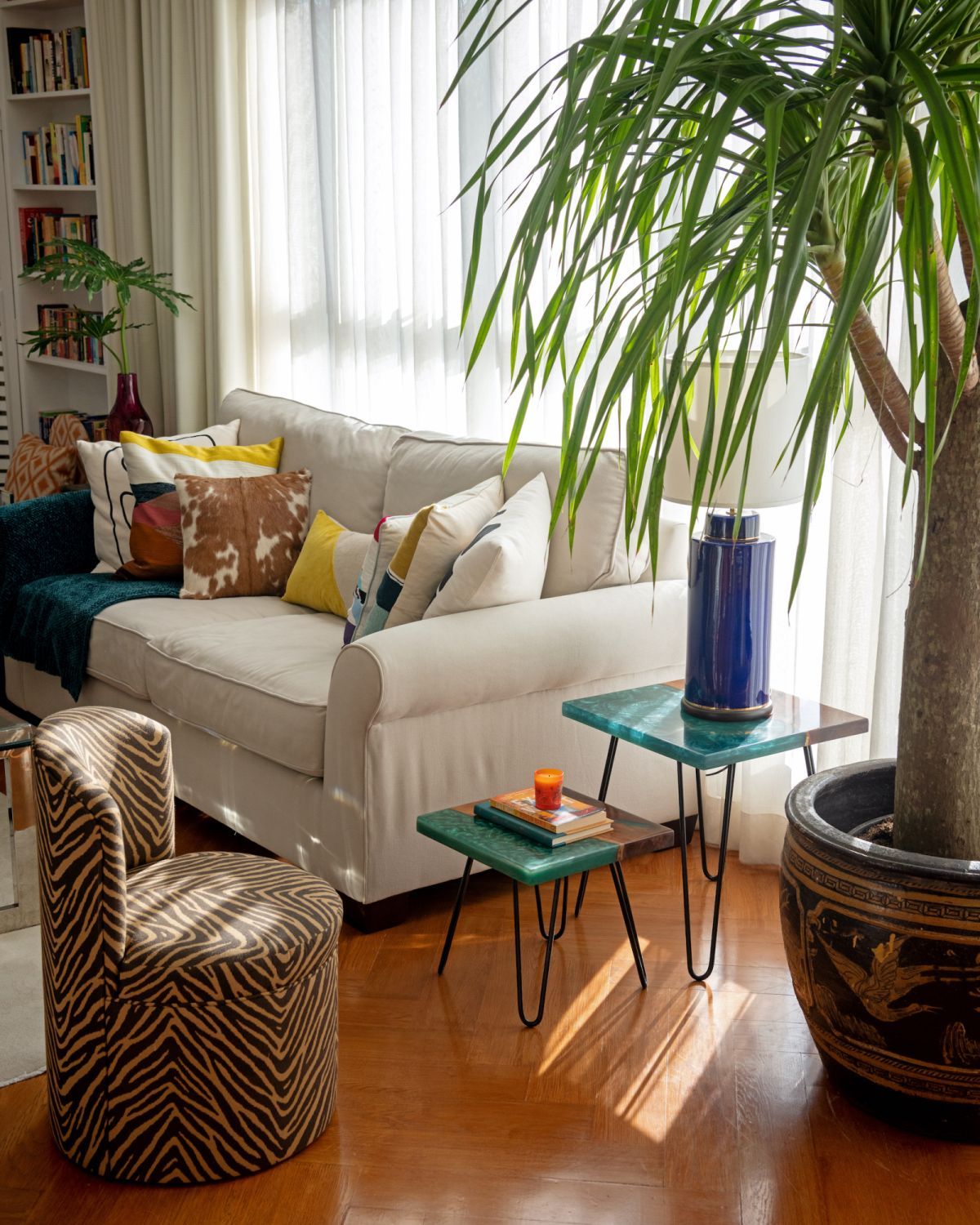A peek at the home library of Tatler Homes Philippines' editor-in-chief Stephanie Zubiri, which features the Zebra chair from Casa Collective, oversized yucca from Wonderplants PH (Image: Scott Allen Woodward)