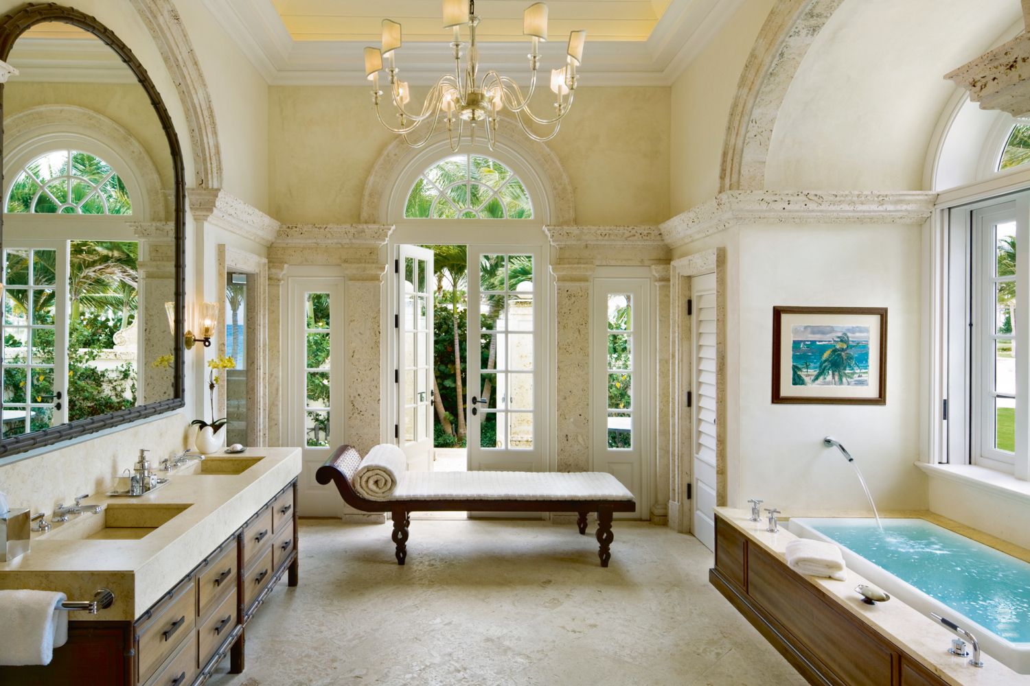 Arched portals contribute to the graceful look of this enviable bathroom in the main villa