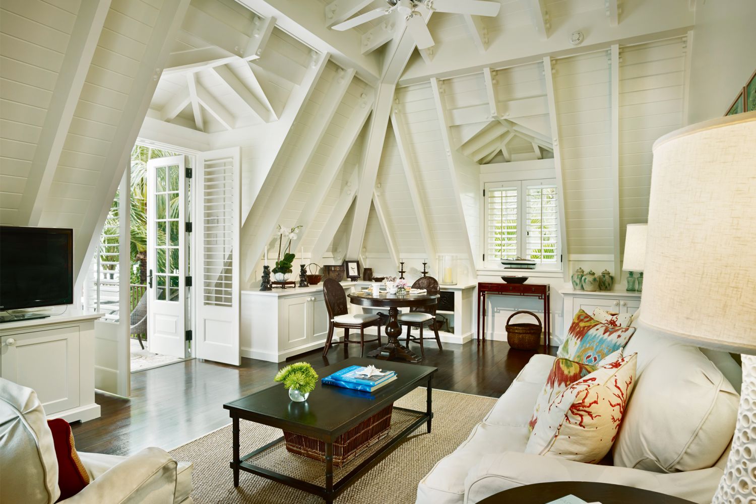 A two-seater dining table creates an intimate breakfast nook in the carriage house