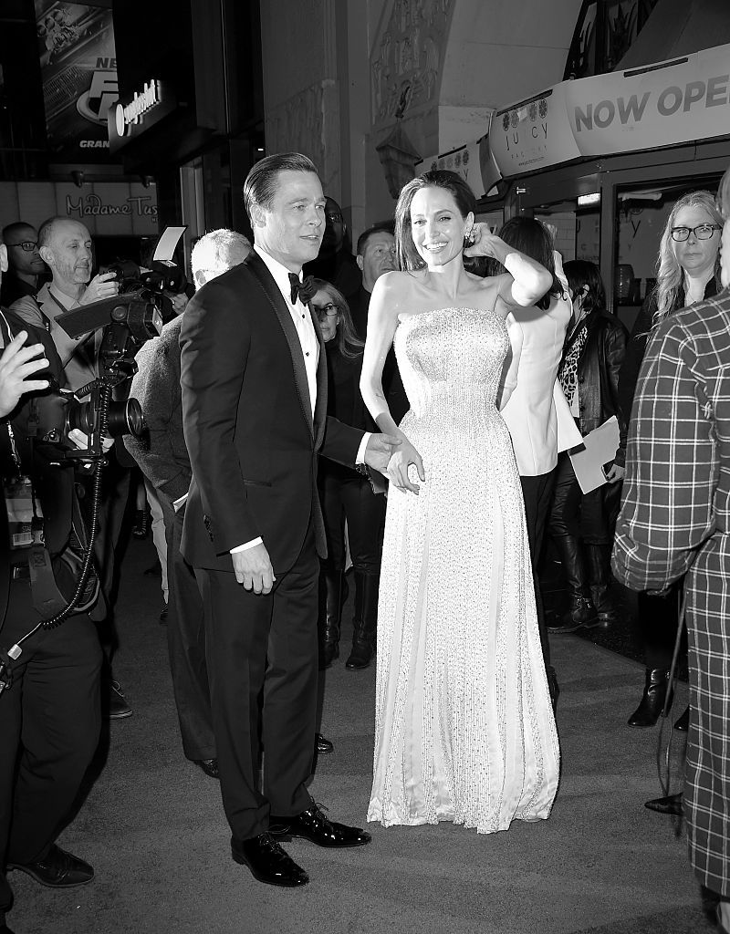 HOLLYWOOD, CA - NOVEMBER 05: Writer-director-producer-actress Angelina Jolie Pitt (L) and actor-producer Brad Pitt attend the opening night gala premiere of Universal Pictures' 'By the Sea' during AFI FEST 2015 presented by Audi at TCL Chinese 6 Theatres on November 5, 2015 in Hollywood, California. (Editors Note: Image has been converted to black and white) (Photo by Jason Merritt/Getty Images)