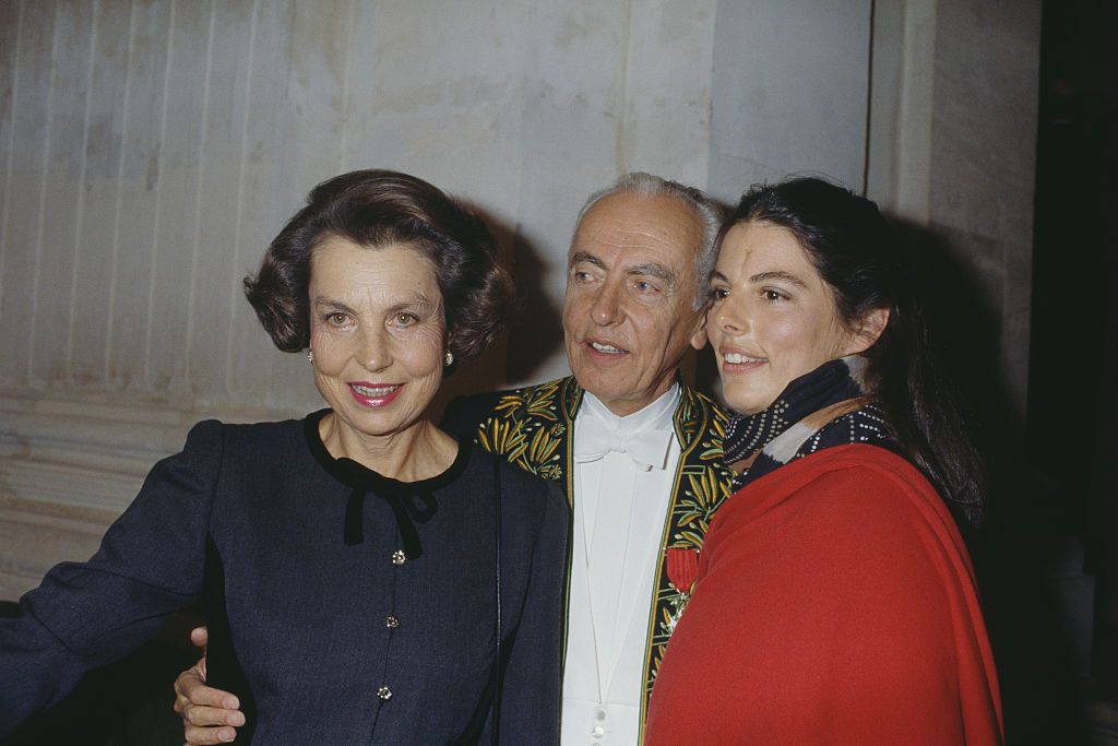 French L'Oreal heiress, socialite, businesswoman and philanthropist Liliane Bettencourt, her husband politician Andre Bettencourt, and their daughter Françoise Bettencourt-Meyers attend his welcome ceremony at the Academie Française. Andre Bettencourt is elected member of the Fine Arts Academy on March 23, 1988 at the seat of Michel Fare. (Photo by Pierre Vauthey/Sygma/Sygma via Getty Images)
