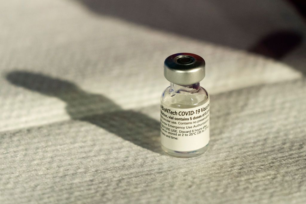 WASHINGTON, DC - DECEMBER 14: A vial of Pfizer's COVID-19 vaccine that received emergency use authorization is seen at George Washington University Hospital on December 14, 2020 in Washington, DC. U.S. Health and Human Services Secretary Alex Azar and U.S. Surgeon General Dr. Jerome Adams will observe hospital workers being vaccinated. (Photo by Jacquelyn Martin-Pool/Getty Images)