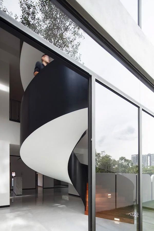 The spiral staircase is meticulously finished and adds a sculptural element (Photo: Lawrence Choo)