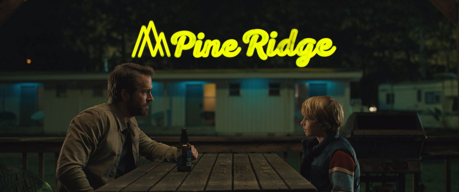 The Adam Project - (L to R) Ryan Reynolds as Big Adam and Walker Scobell as Young Adam. Cr. Netflix © 2022