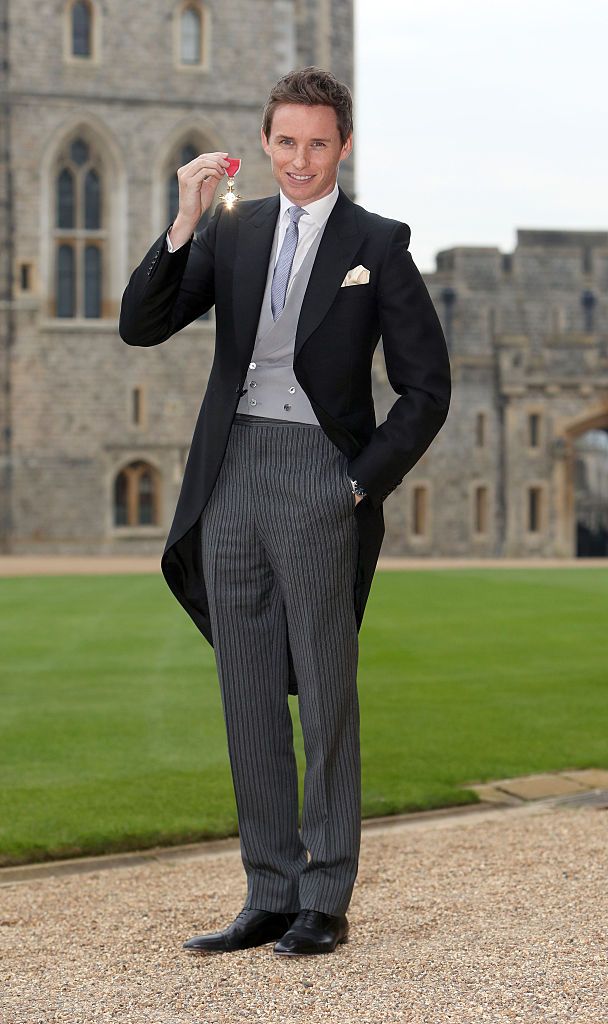 WINDSOR ,ENGLAND - DECEMBER 2: Eddie Redmayne poses after he was made an OBE (Officer of the Order of the British Empire) by Queen Elizabeth II during an investiture ceremony at Windsor Castle on December 2, 2016 in Windsor, England. (Photo by Steve Parsons-WPA Pool/Getty Images)