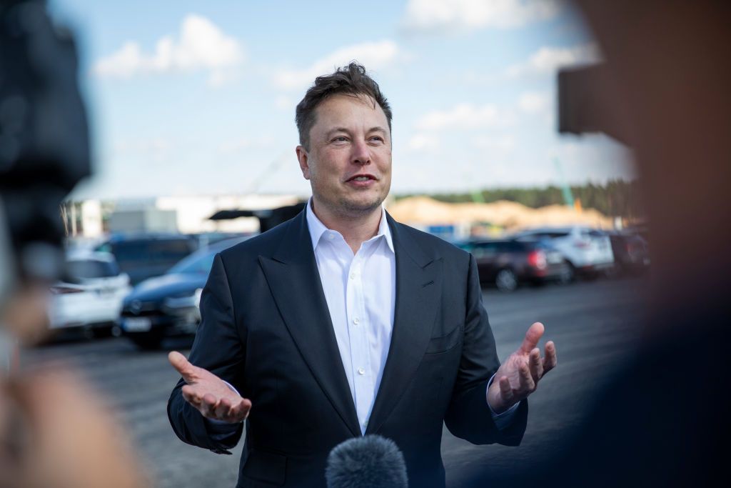 GRUENHEIDE, GERMANY - SEPTEMBER 03: Tesla head Elon Musk talks to the press as he arrives to to have a look at the construction site of the new Tesla Gigafactory near Berlin on September 03, 2020 near Gruenheide, Germany. Musk is currently in Germany where he met with vaccine maker CureVac on Tuesday, with which Tesla has a cooperation to build devices for producing RNA vaccines, as well as German Economy Minister Peter Altmaier yesterday. (Photo by Maja Hitij/Getty Images)