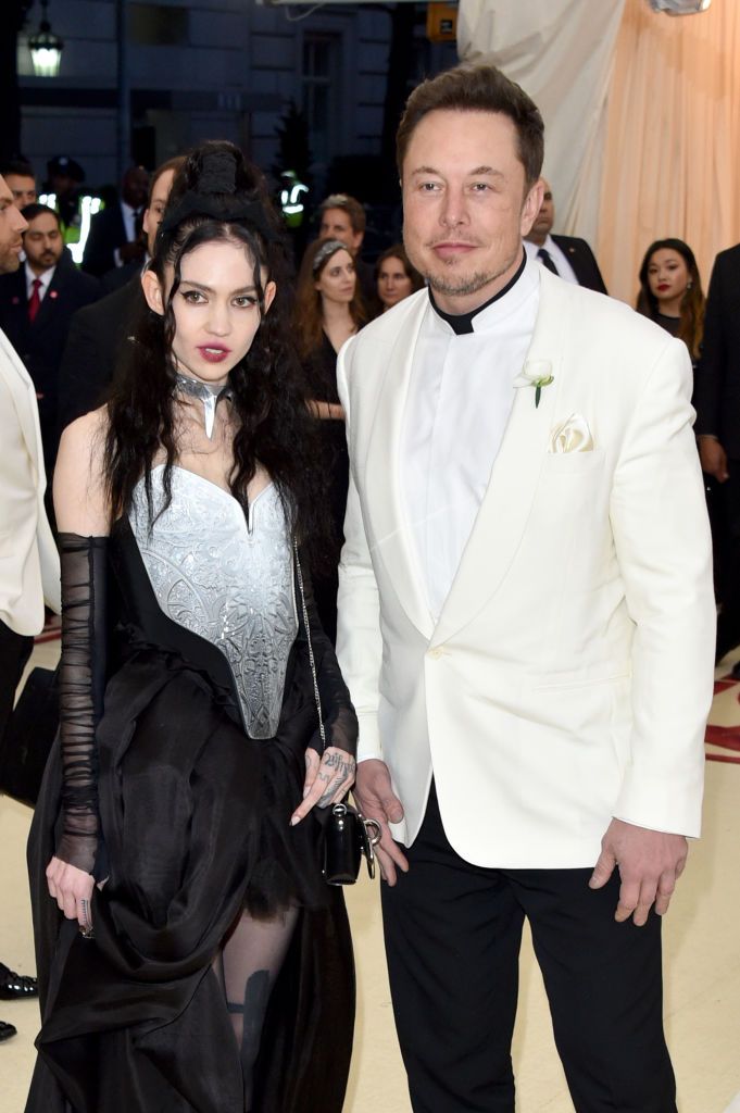 NEW YORK, NY - MAY 07: Grimes (L) and Elon Musk attend the Heavenly Bodies: Fashion & The Catholic Imagination Costume Institute Gala at The Metropolitan Museum of Art on May 7, 2018 in New York City. (Photo by John Shearer/Getty Images for The Hollywood Reporter)