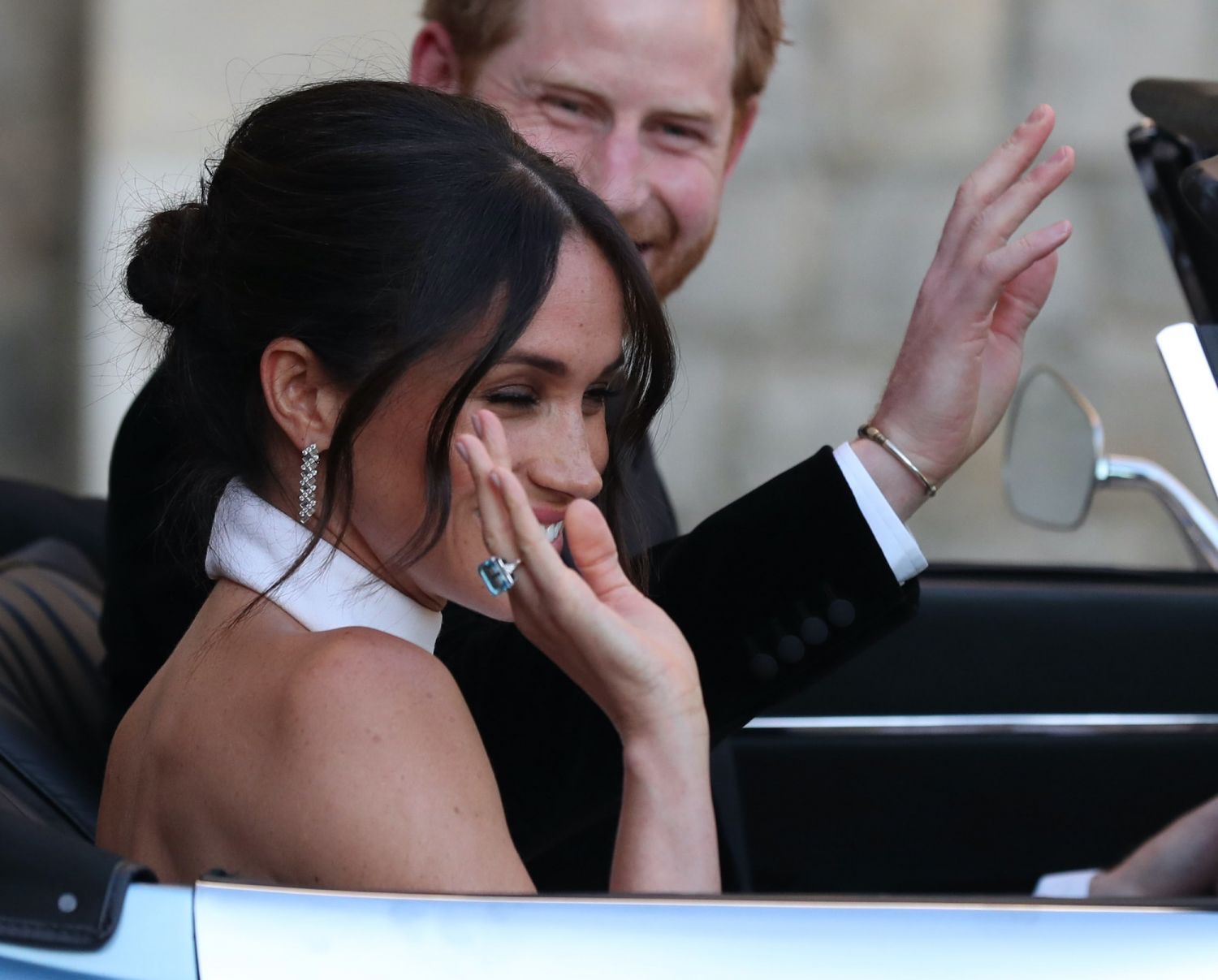 The newly married Duke and Duchess of Sussex, Meghan Markle and Prince Harry, leaving Windsor Castle after their wedding to attend an evening reception at Frogmore House, hosted by the Prince of Wales. The bride wore a ring which belonged to Diana, Princess of Wales. PRESS ASSOCIATION Photo. Picture date: Saturday May 19, 2018. Meghan wore See PA story ROYAL Wedding. Photo credit should read: Steve Parsons/PA Wire