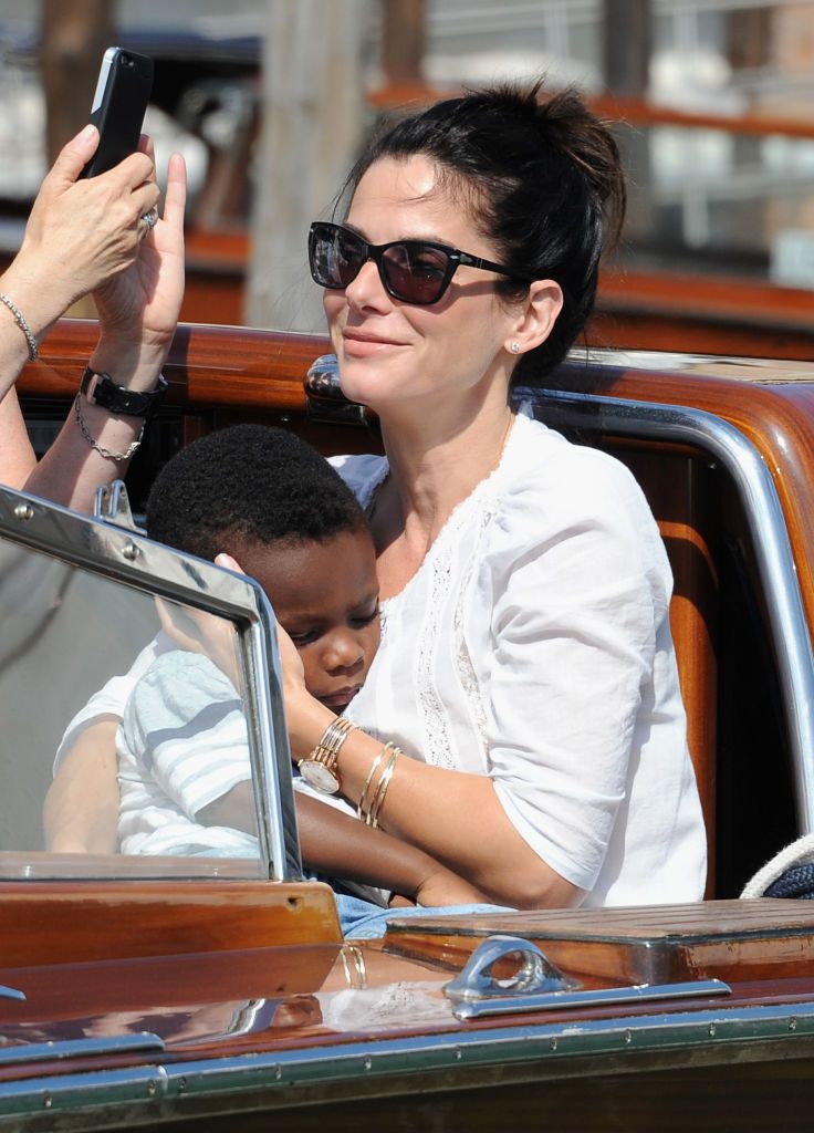 VENICE, ITALY - AUGUST 27: Actress Sandra Bullock (R) and son Louis Bardo Bullock is seen during the 70th Venice International Film Festival on August 27, 2013 in Venice, Italy. (Photo by Jacopo Raule/FilmMagic)