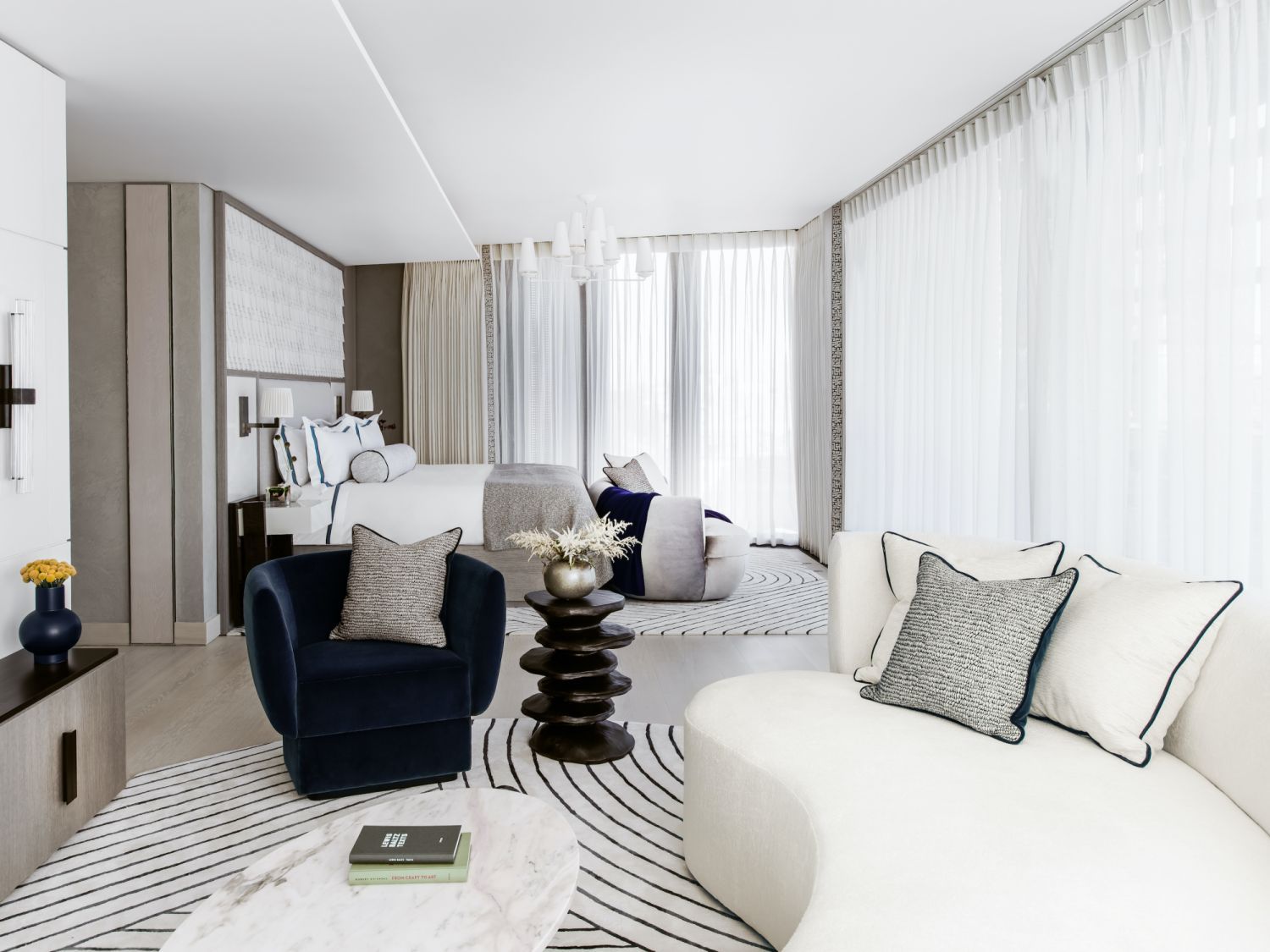 This minimalist bedroom by designer Charu Gandhi offers a cosy atmosphere with matching rugs (Photo: Patrick Williamson)
