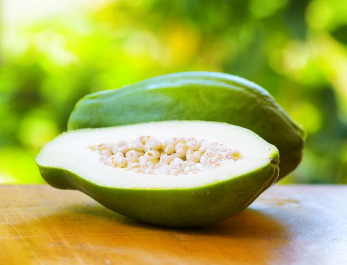 Green papaya on nature background.