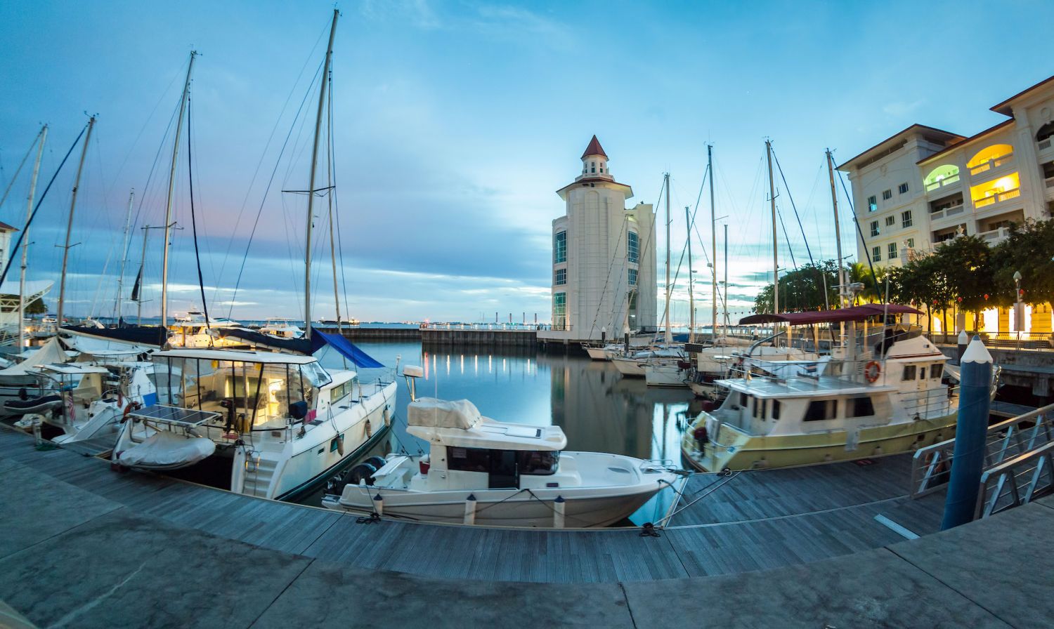 Straits Quay Lighthouse view during sunrise with yachts and boats as foreground