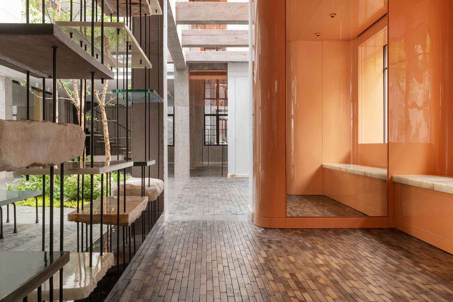 The EP YAYING flagship boutique features  a contemporary interior that combines the raw beauty of the materials like concrete and jade and concrete with elements of Chinese craftsmanship