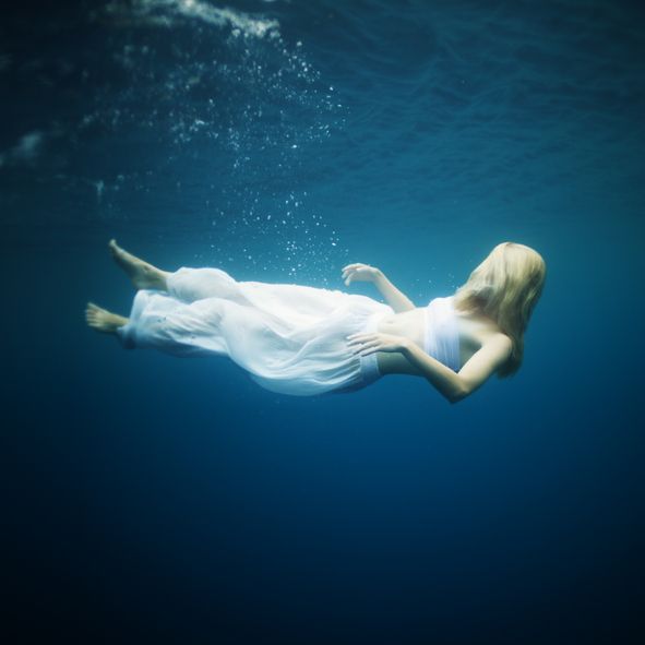 Young woman fall into deep water