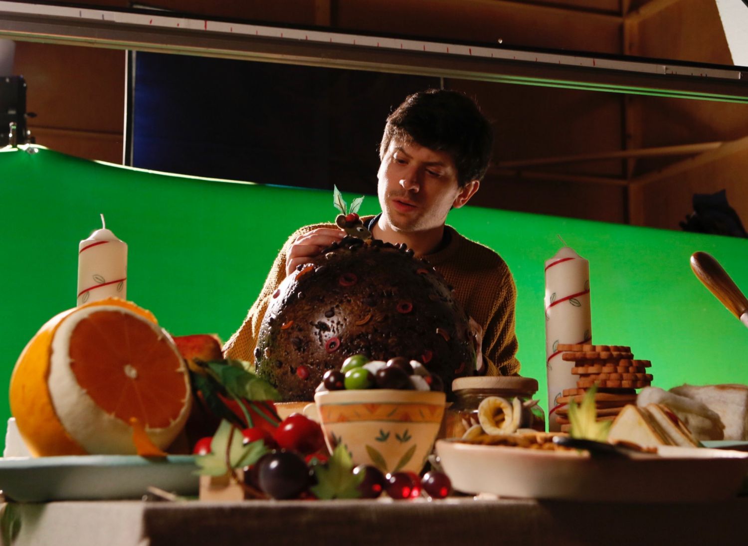 ROBIN ROBIN Director Dan Ojari briefing for the shot at the dinner table. Cr. Dave Alex Riddett/Netflix Â© 2021