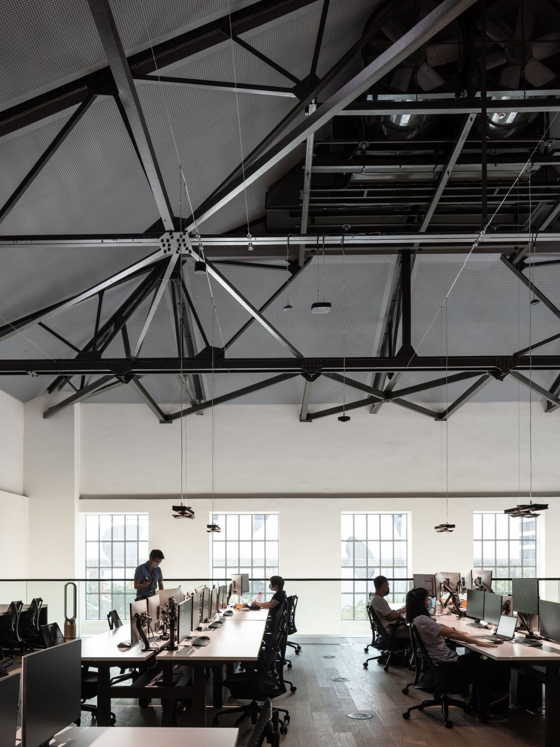 The minimalist interiors celebrate industrial design with its bold style