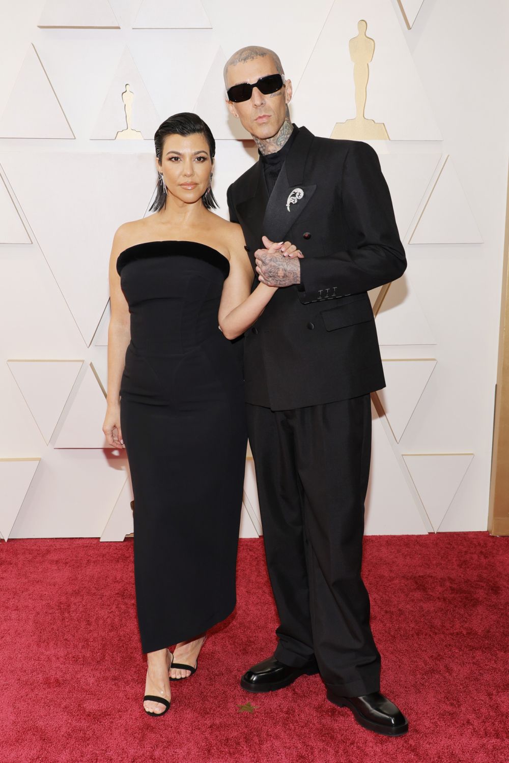 HOLLYWOOD, CALIFORNIA - MARCH 27: (L-R) Kourtney Kardashian and Travis Barker attend the 94th Annual Academy Awards at Hollywood and Highland on March 27, 2022 in Hollywood, California. (Photo by Mike Coppola/Getty Images)