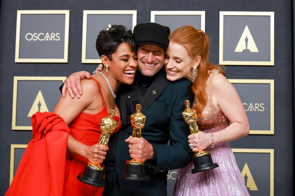 HOLLYWOOD, CA - March 27, 2022. Ariana DeBose, winner of the Oscar for Actress in a Supporting Role for West Side Story," Troy Kotsur, winner of the Oscar for Actor in a Supporting Role for "CODA," and Jessica Chastain, winner of the Oscar for Actress in a Leading Role for The Eyes of Tammy Faye,  in the Photo Room during the 94th Academy Awards at the Dolby Theatre at Ovation Hollywood on Sunday, March 27, 2022.  (Allen Schaben / Los Angeles Times via Getty Images)
