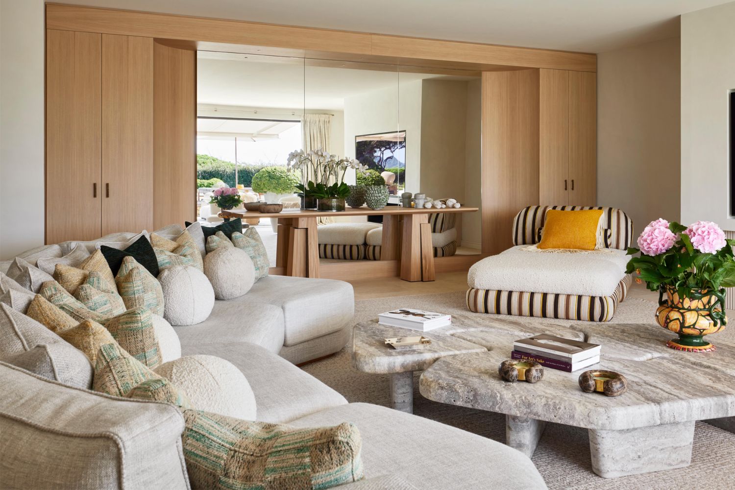 A mix of materials, including marble, travertine and wood, adds warmth and richness to the interior