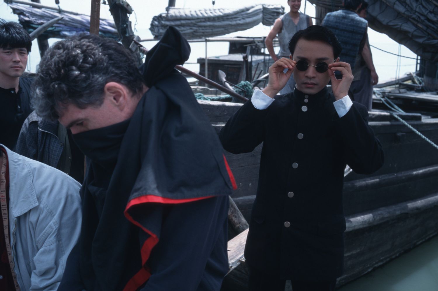 SUZHOU, CHINA - 1996/01/01: Hong Kong actor Leslie Cheung Kwok Wing, with cinema photographer Chris Doyle (mask) during the filming of 'Temptress Moon'. (Photo by Gerhard Joren/LightRocket via Getty Images)