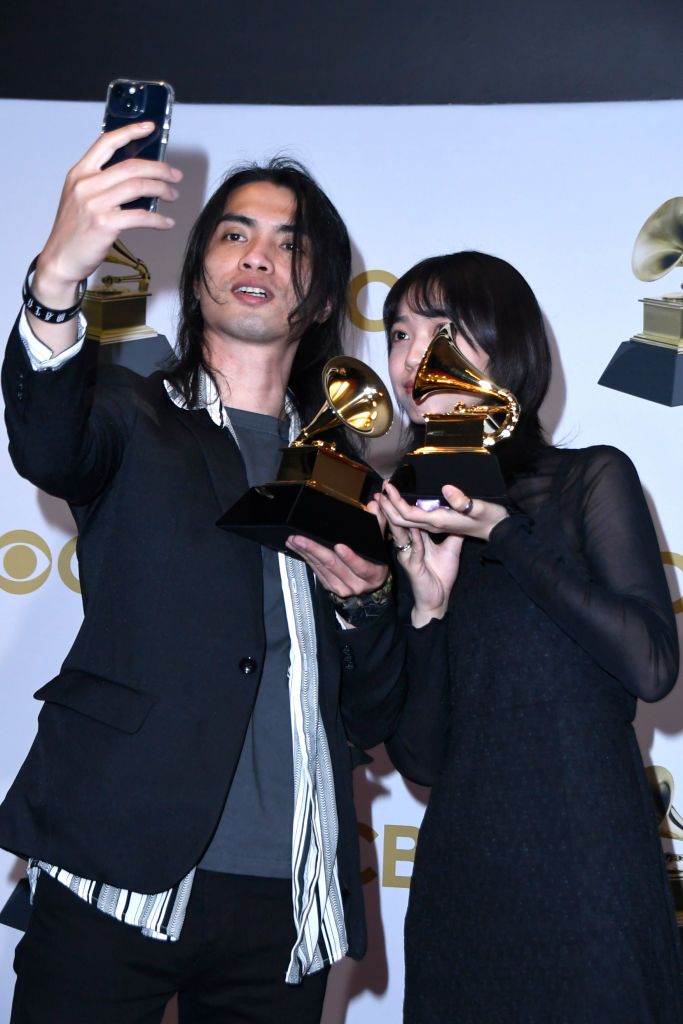 LAS VEGAS, NEVADA - APRIL 03: Li Jheng Han and Yu Wei pose with the award for Best Recording Package "Pakelang" pose in the press room during the 64th Annual GRAMMY Awards at MGM Grand Garden Arena on April 03, 2022 in Las Vegas, Nevada. (Photo by Mindy Small/Getty Images)