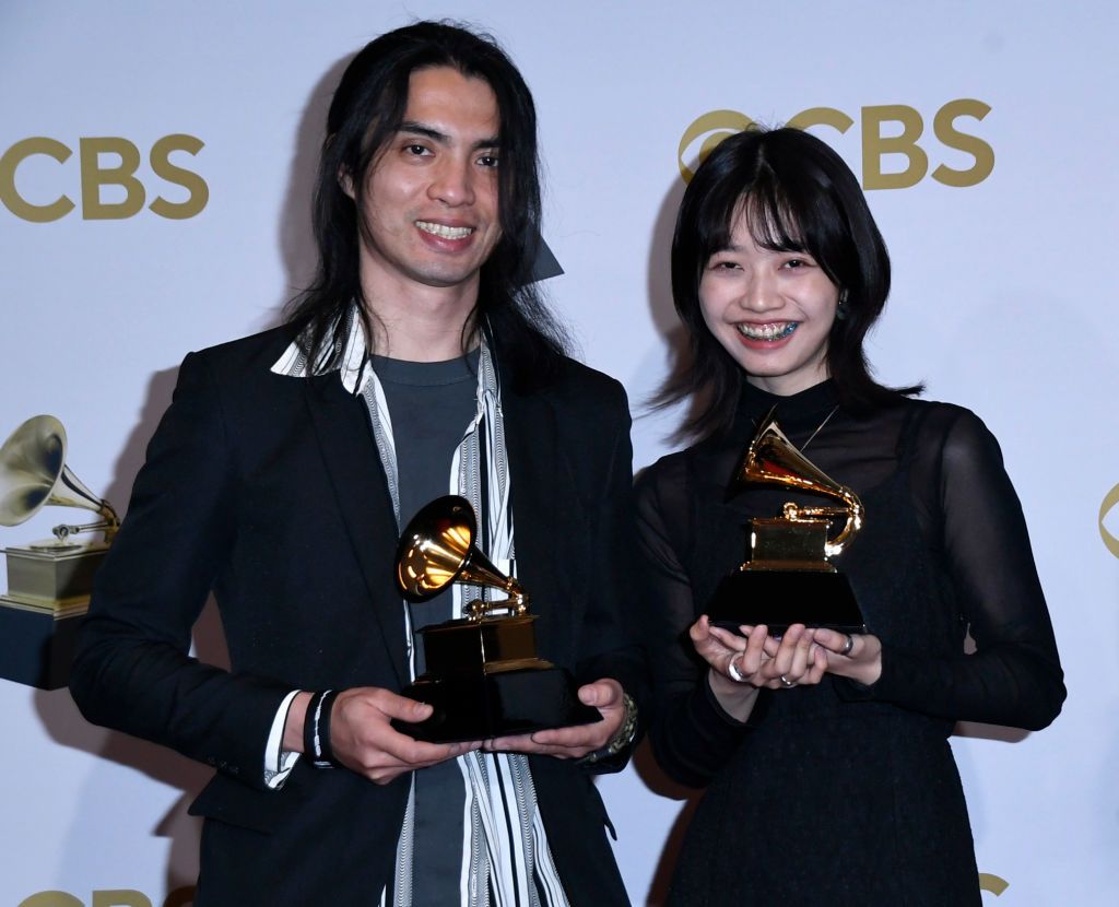 LAS VEGAS, NEVADA - APRIL 03: Li Jheng Han and Yu Wei pose with the award for Best Recording Package "Pakelang" pose in the press room during the 64th Annual GRAMMY Awards at MGM Grand Garden Arena on April 03, 2022 in Las Vegas, Nevada. (Photo by Mindy Small/Getty Images)