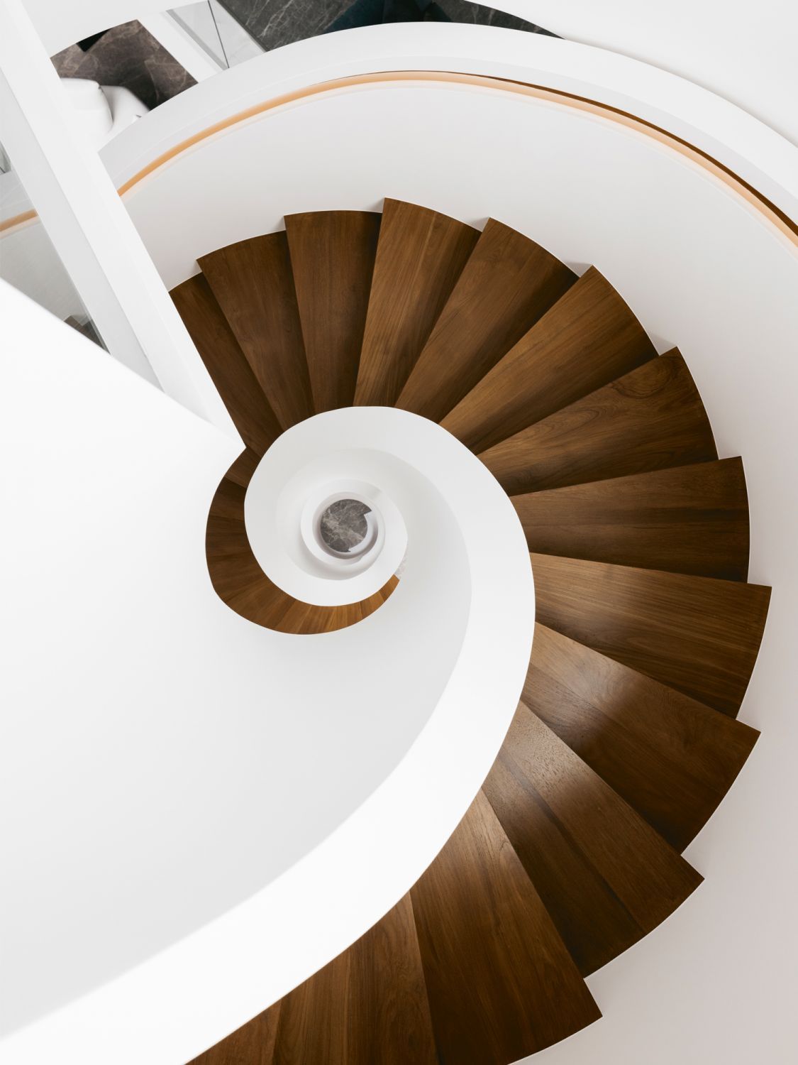 A top-down view of the staircase, which features Burmese teak steps (Photo: Studio Periphery)