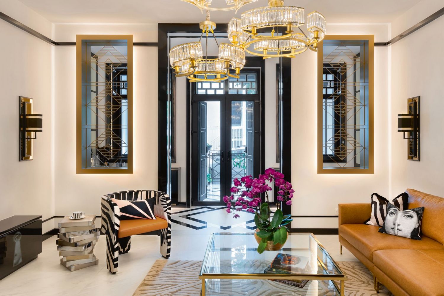 The zebra stripes on the armchair, accent cushion and rug add a playful touch to the living room