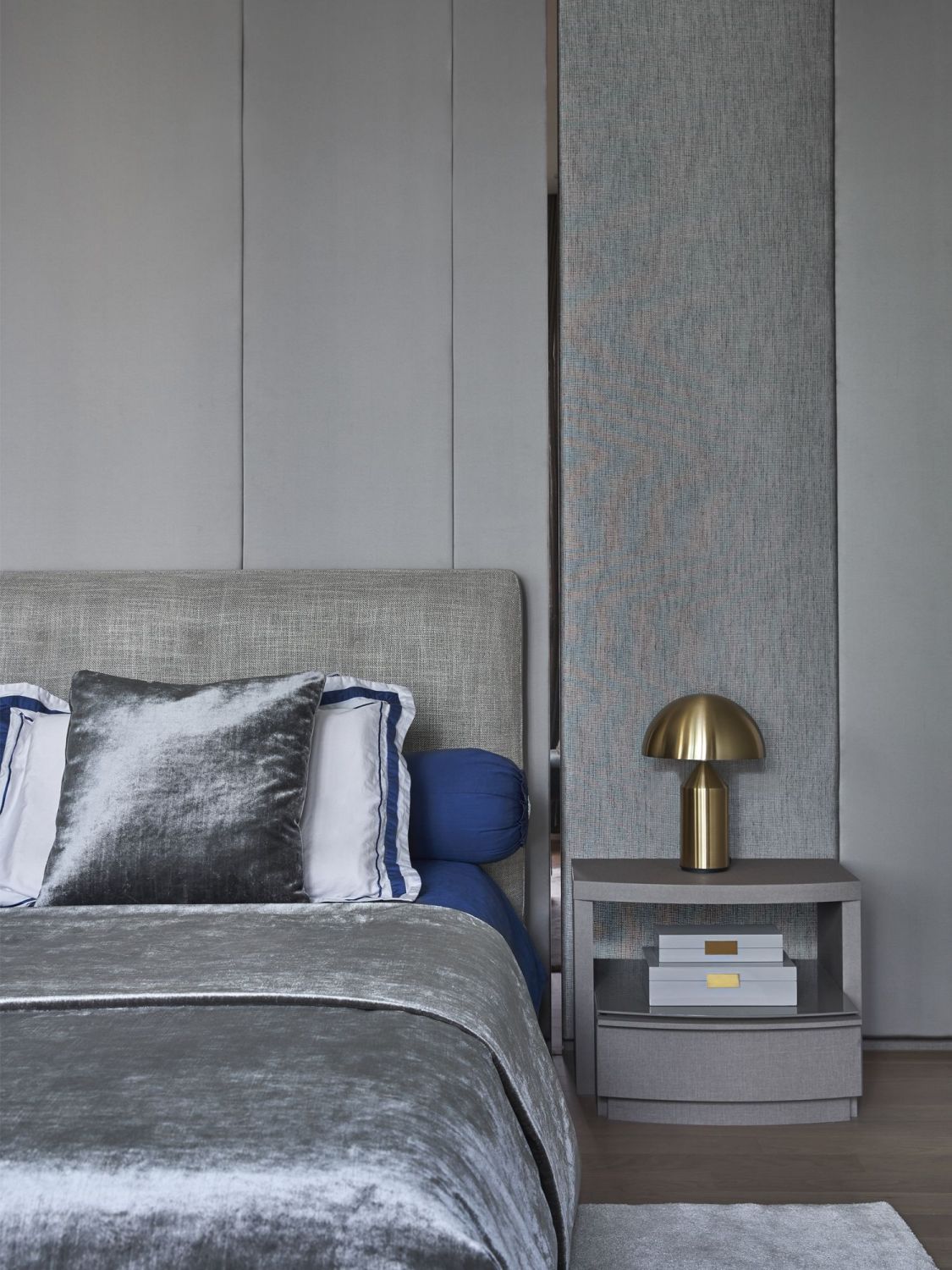 The use of upholstered panels in shades of grey and chrome accents is luxurious yet understated (Photo: Jasper Yu/Jyu Studio)