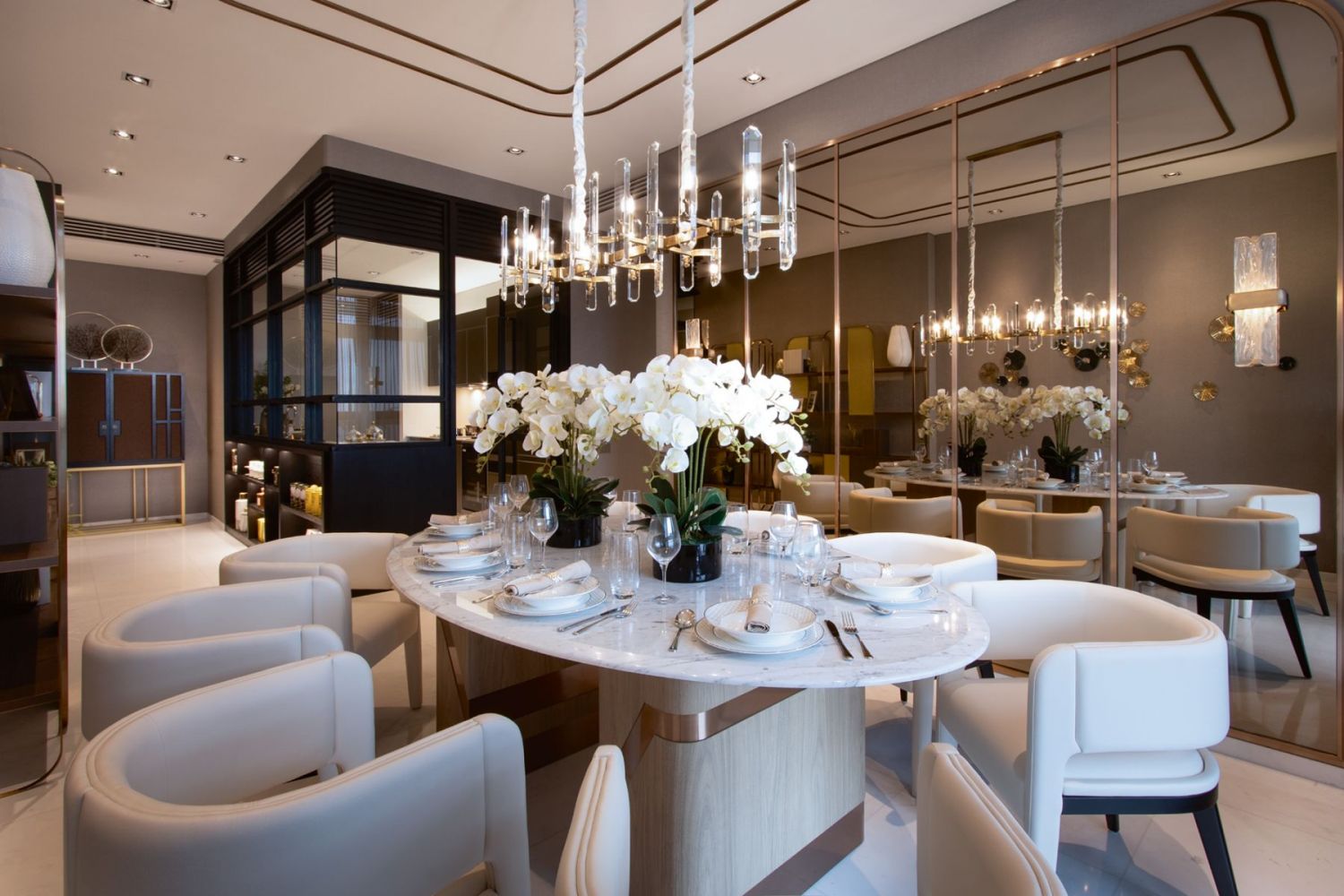Tinted mirrored panels and champagne gold trimmings contribute to the home’s opulent appearance
