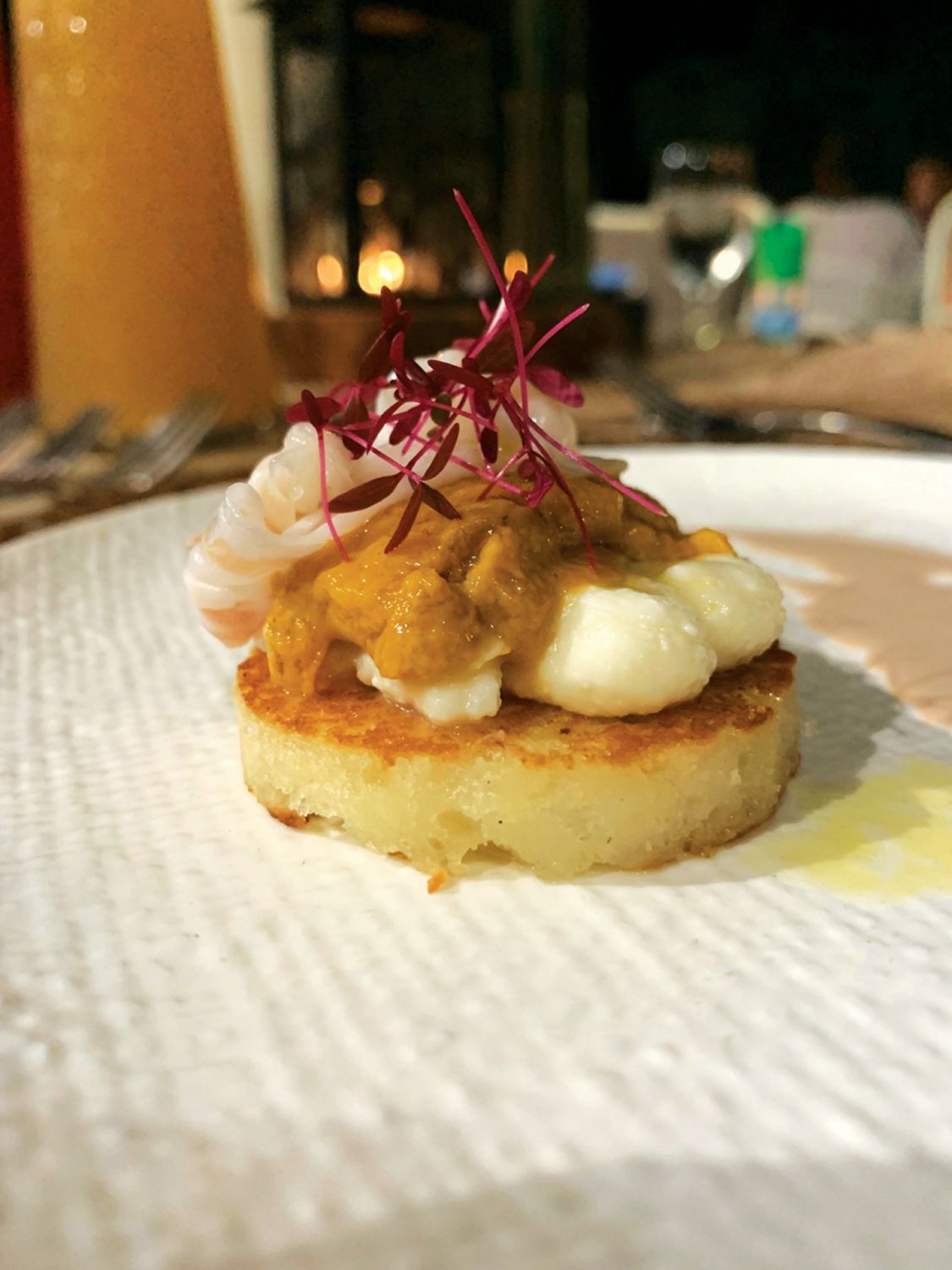 Margarita's savoury bibingka is topped with uni and lardo